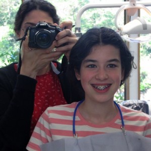 Top braces on - checking out her new look in the mirror