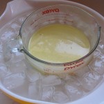 ice-bath-2 after twenty minutes of slowly stirring in the lye, the goat milk has turned yellow from the reaction, but stayed cool