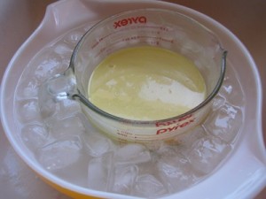 after twenty minutes of slowly stirring in the lye, the goat milk has turned yellow from the reaction, but stayed cool