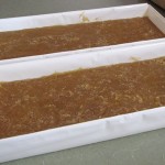 just-in-mold the cooked soap put in the molds (plastic drawer trays lined with freezer paper)