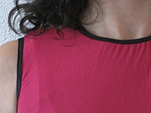 close up of fold-over elastic at neck and arm holes