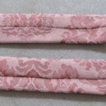 Press with seam in middle, tuck under one end raw edges, slip stitch closed