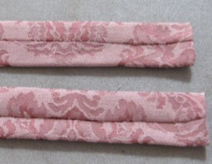 Press with seam in middle, tuck under one end raw edges, slip stitch closed