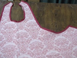Press bias tape out from edges of apron and flat