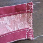 Stitch right sides of neck edges together, zig-zag or serge raw edges