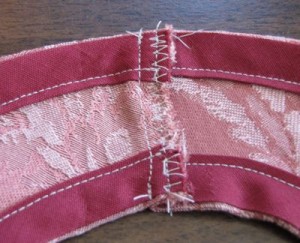 Stitch down raw edge - wrong side