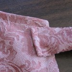 Stitch each tie on at apron corners, zig zag end folded under