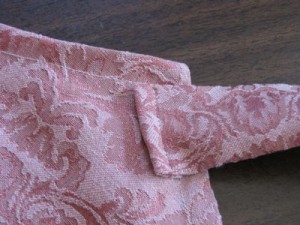 Stitch each tie on at apron corners, zig zag end folded under